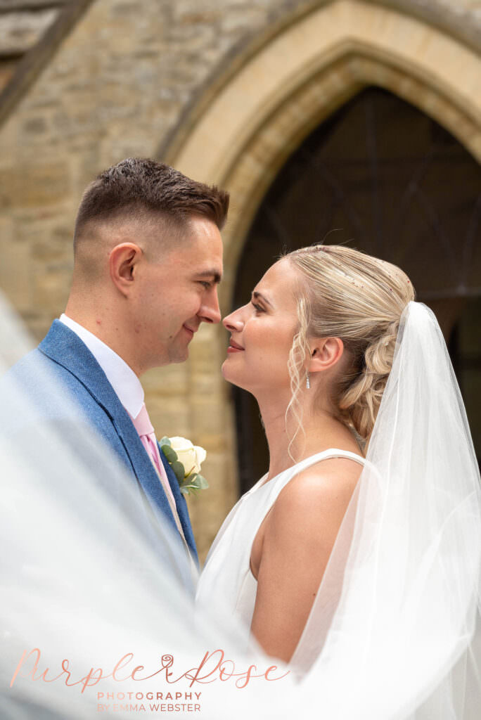 Bride and groom looking into each others eyes