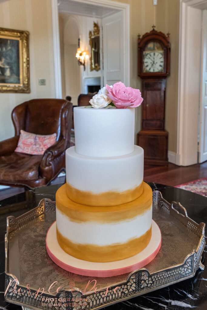 White and gold wedding cake