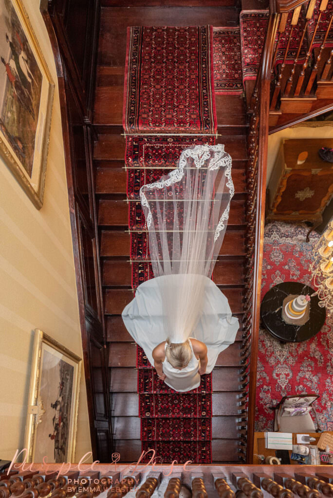 Bride walking down a staircase