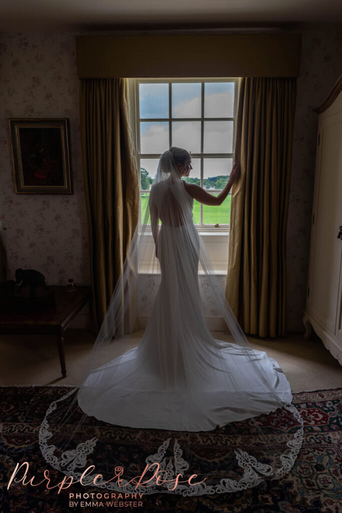 Bride in front of a window