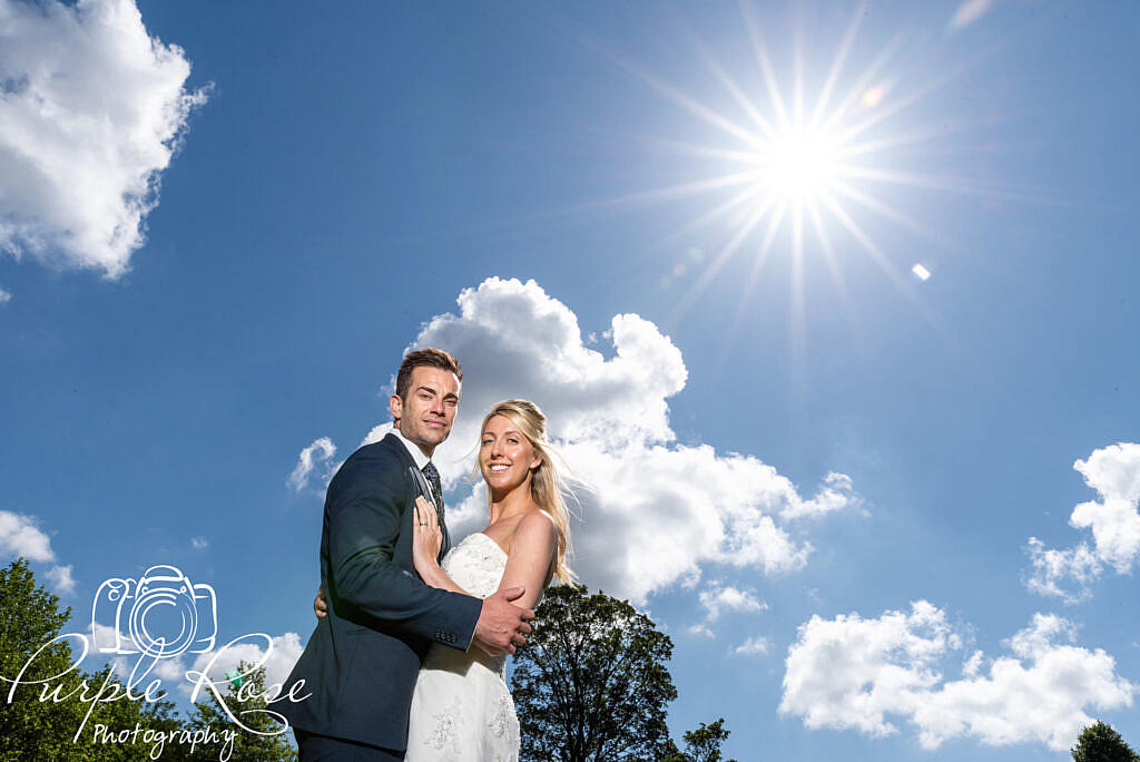 bride and groom smiling