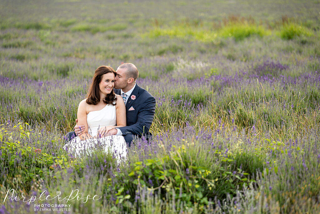 Bride and groom sat in a lavender field