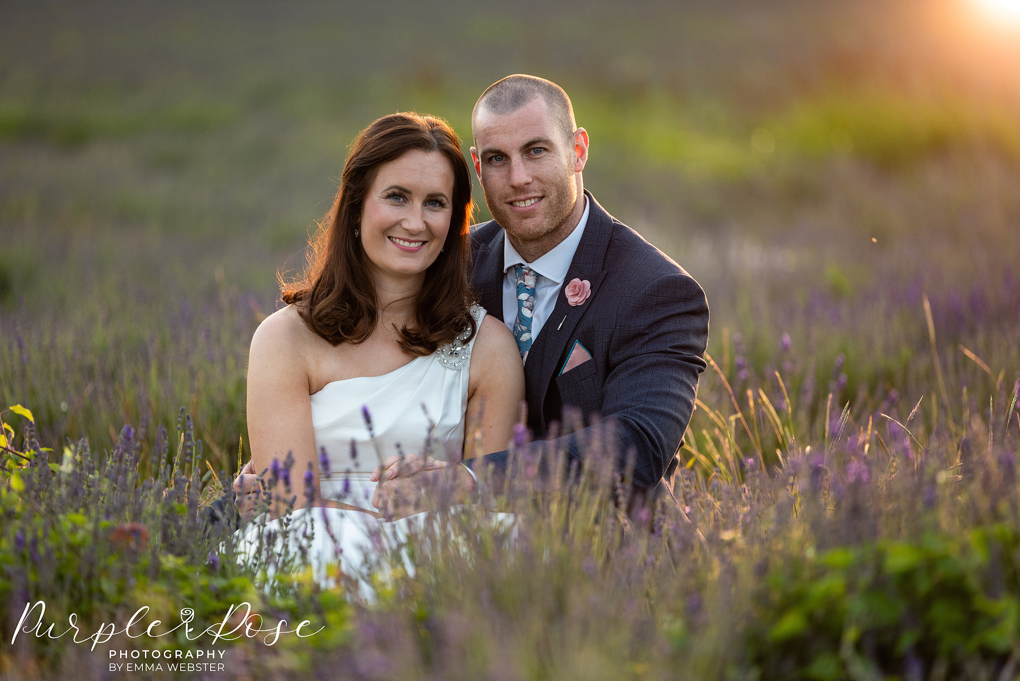 Bride and groom bathed in golden light