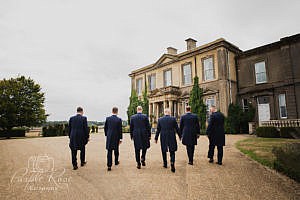 Groomsmen arriving at wedding venue