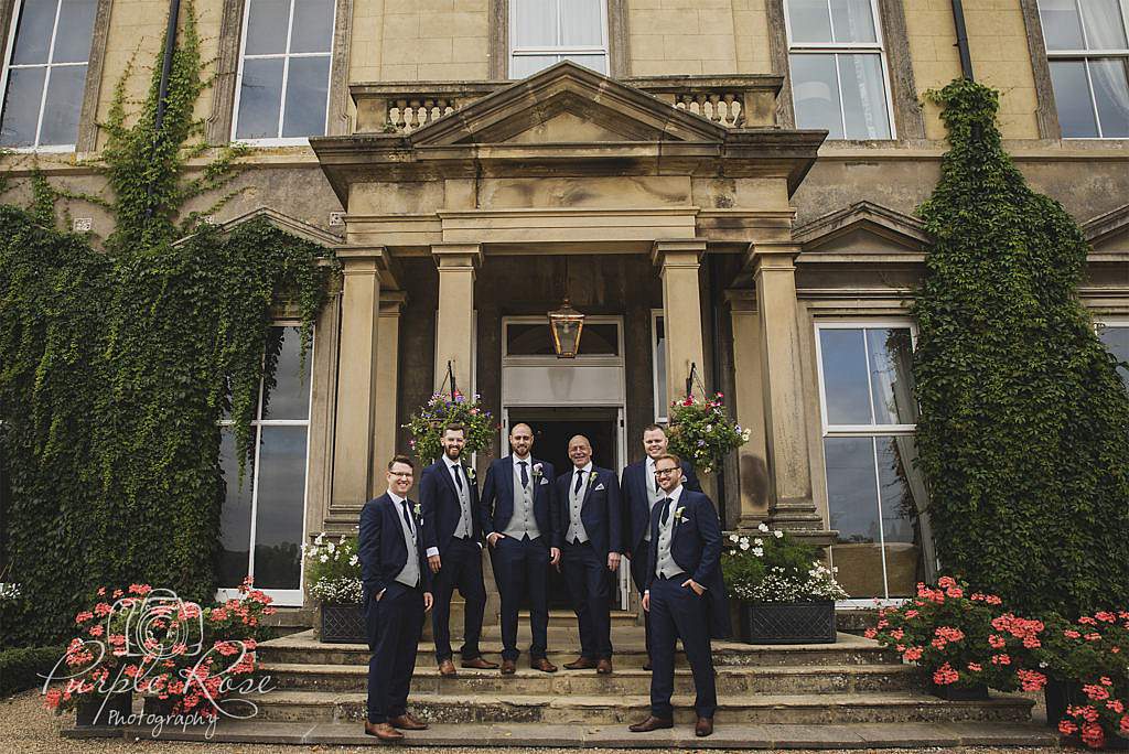 Groomsmen in front of the wedding venue