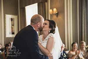 Bride and grooms first kiss