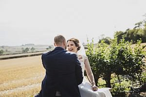 Bride and groom laughing together