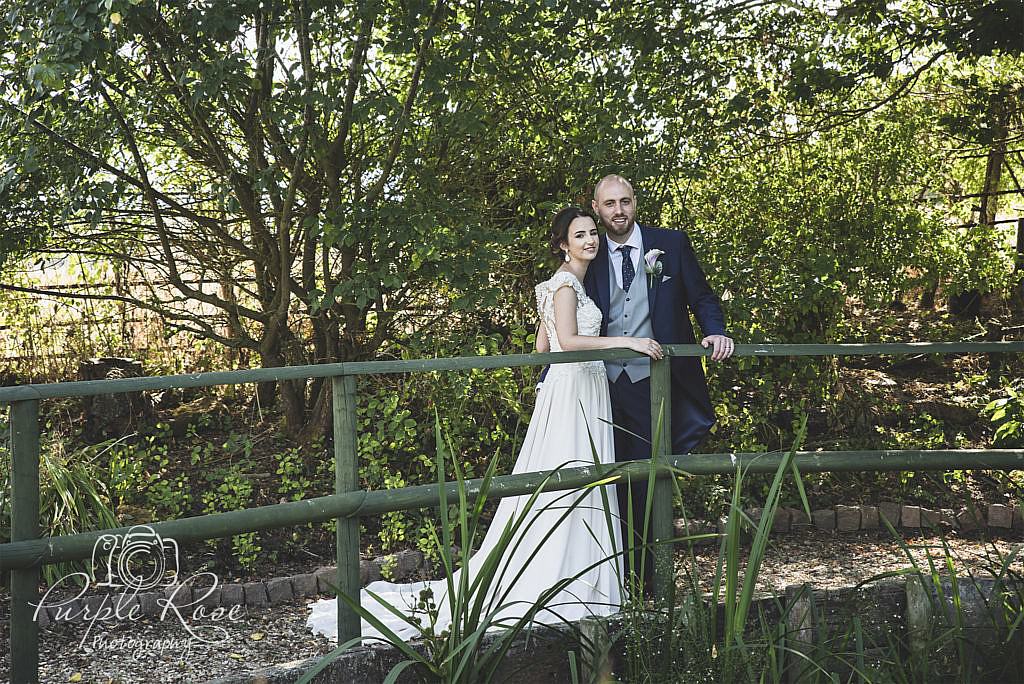 Bride and groom on a bridge