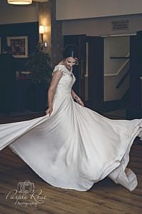Bride twirling in her wedding dress