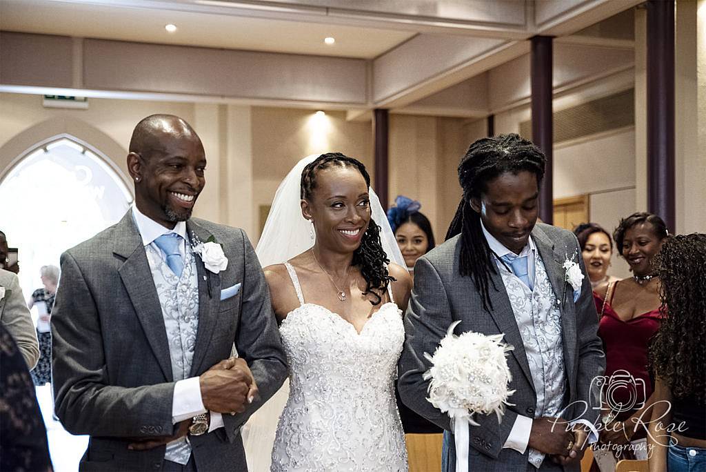 Bride wlaking into church for her wedding