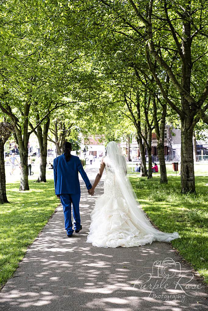 Bride and groom walking hand in hand