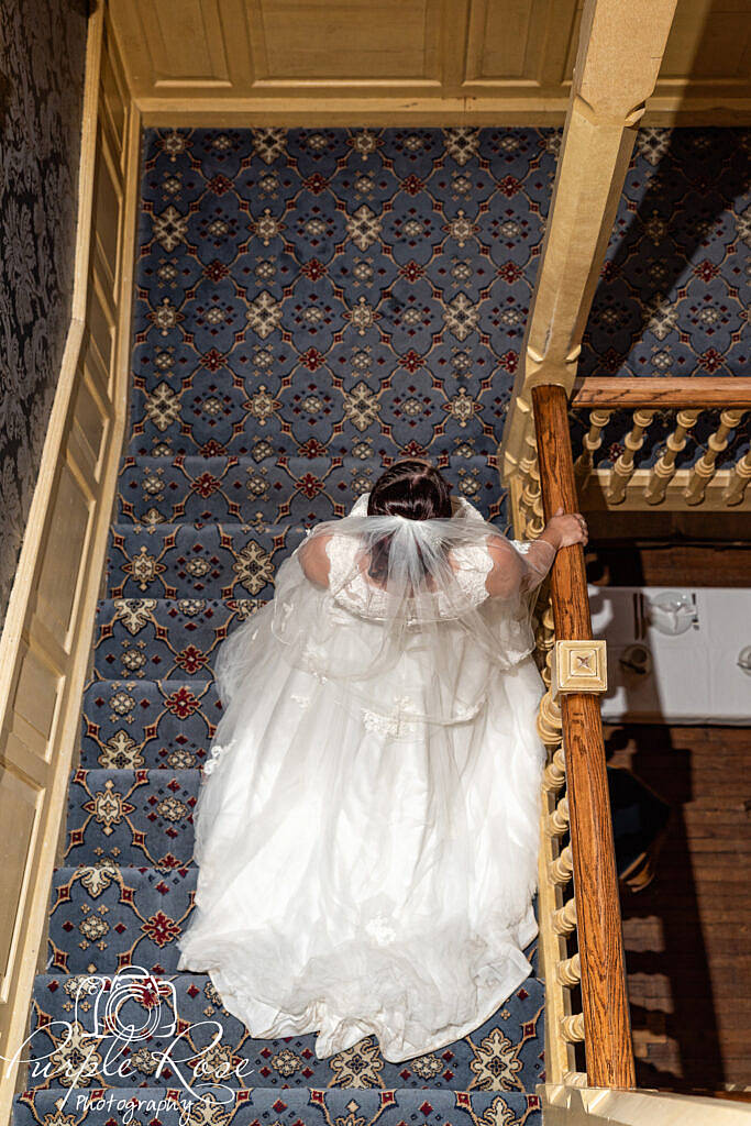 Bride walking down a staircase