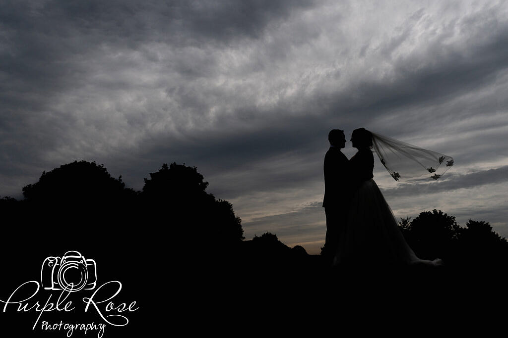 Silhouette of a bride and groom