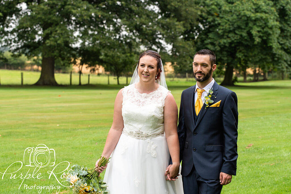 Bride and groom walking hand in hand