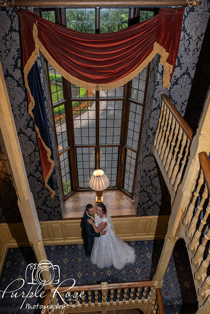 Bride and groom looking up at the camera