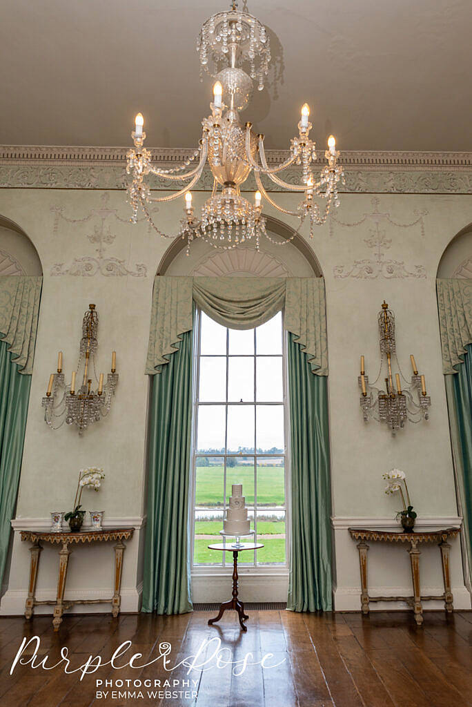 Cake in front of a windwo at Kelmarsh Hall Northampton