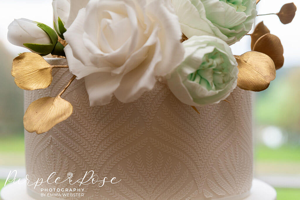 Close up of intricate details on a wedding cake at Kelmarsh Hall Northampton