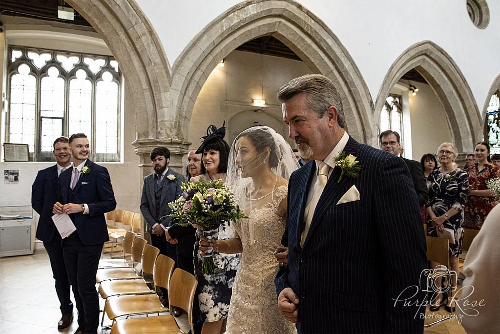 Bride walking into the church