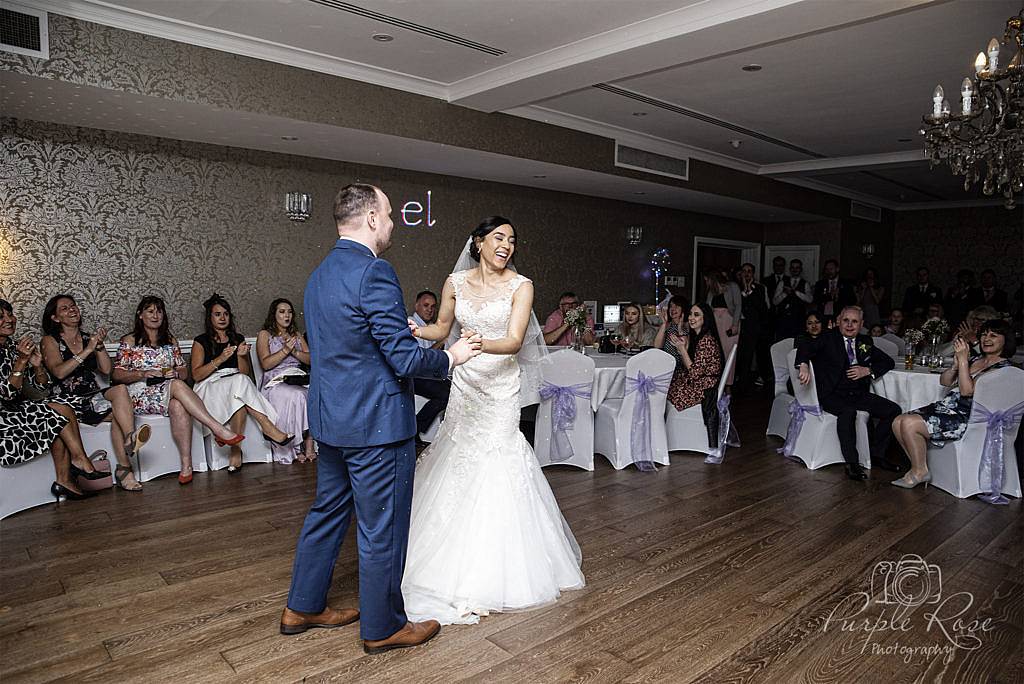 Bride and groom enjoying their first dance together as man and wife