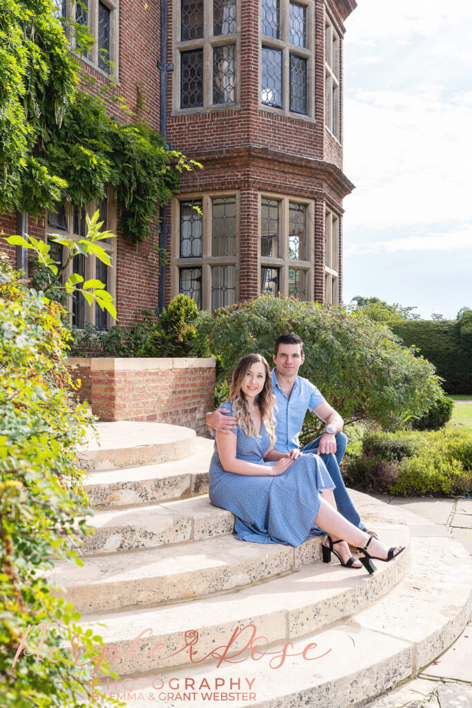 Couple sat in staircase