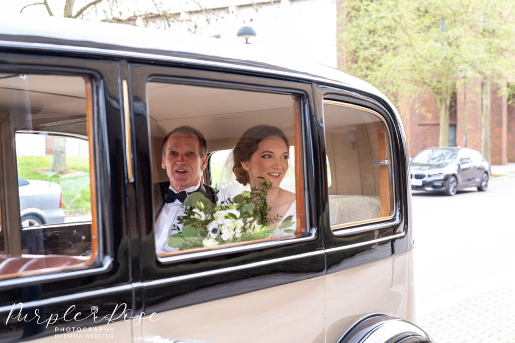 Bride arriving in a car at registry office