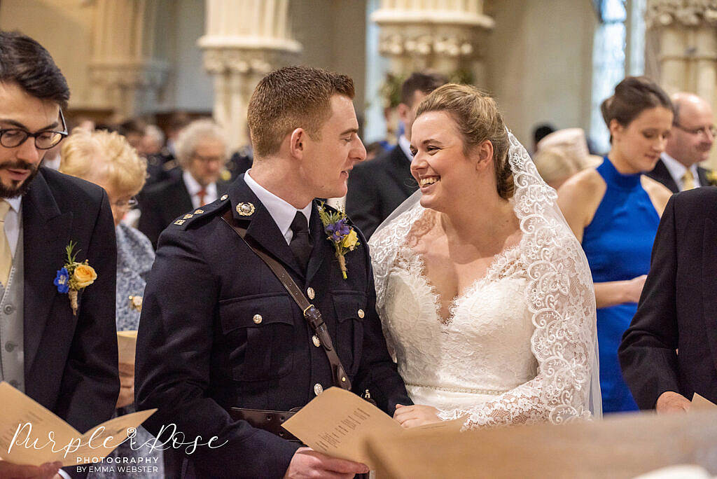 Bride smiling during her church ceremony