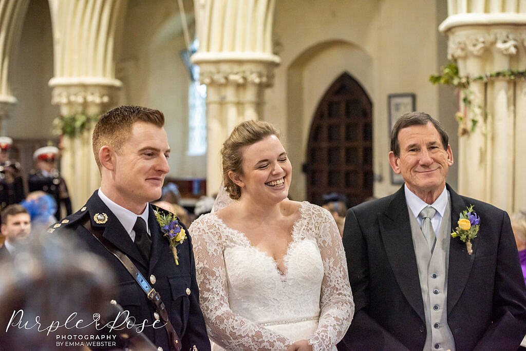 Father standing proudly by his daughter in the church