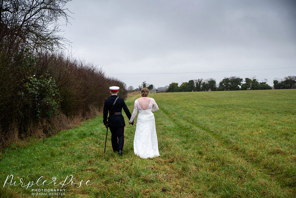 Bride and groom walking away