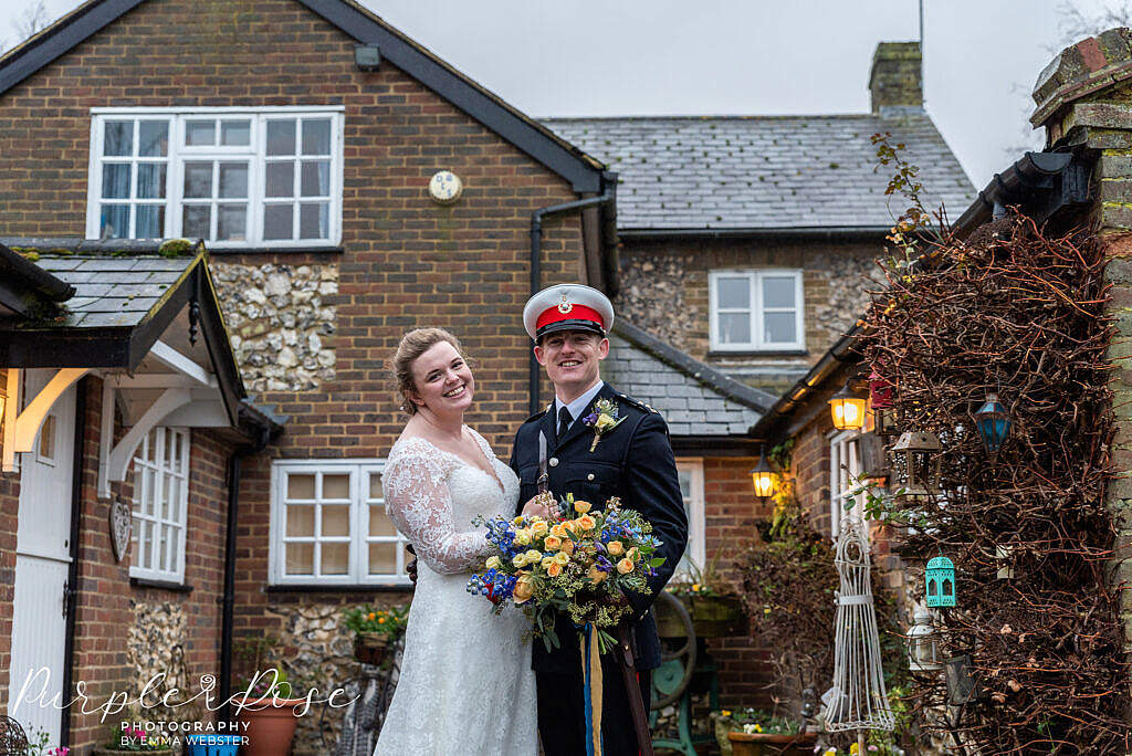 bride and groom embracing in a courtyard