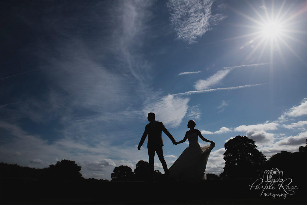 Silhouette of bride and groom on a wall