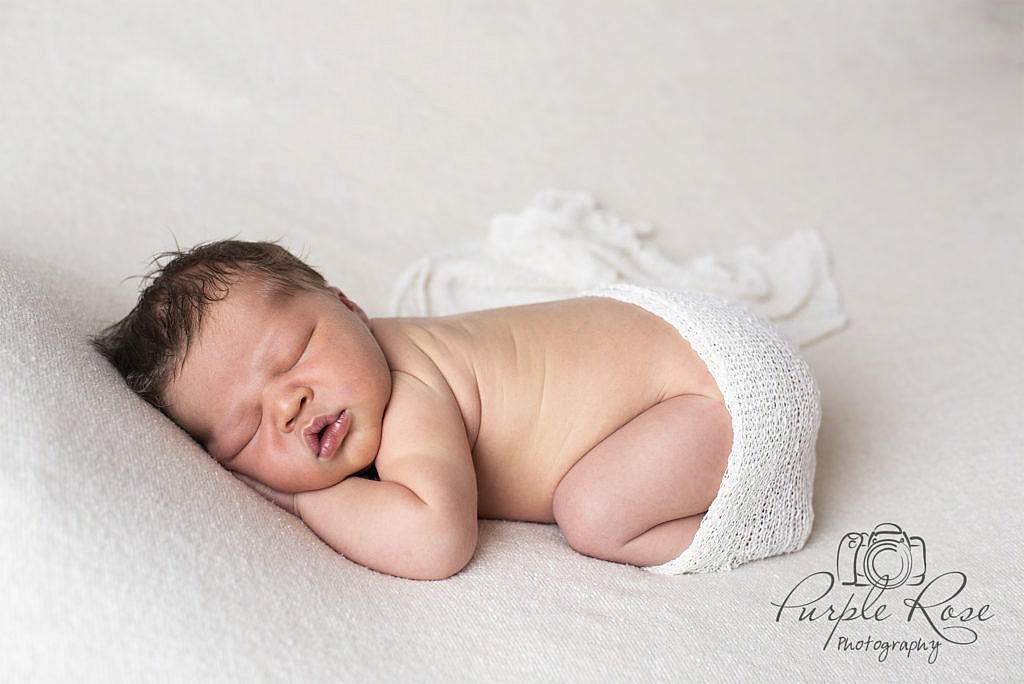 Baby sleeping on a blanket