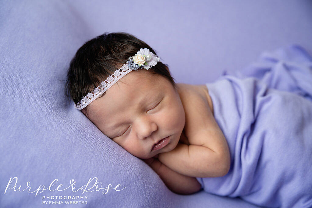 Newborn baby sleeping on her side