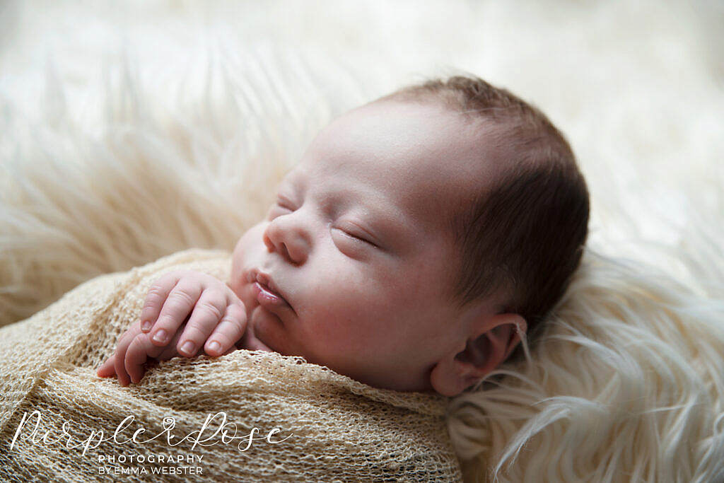 Close up photo of a newborn baby sleeping
