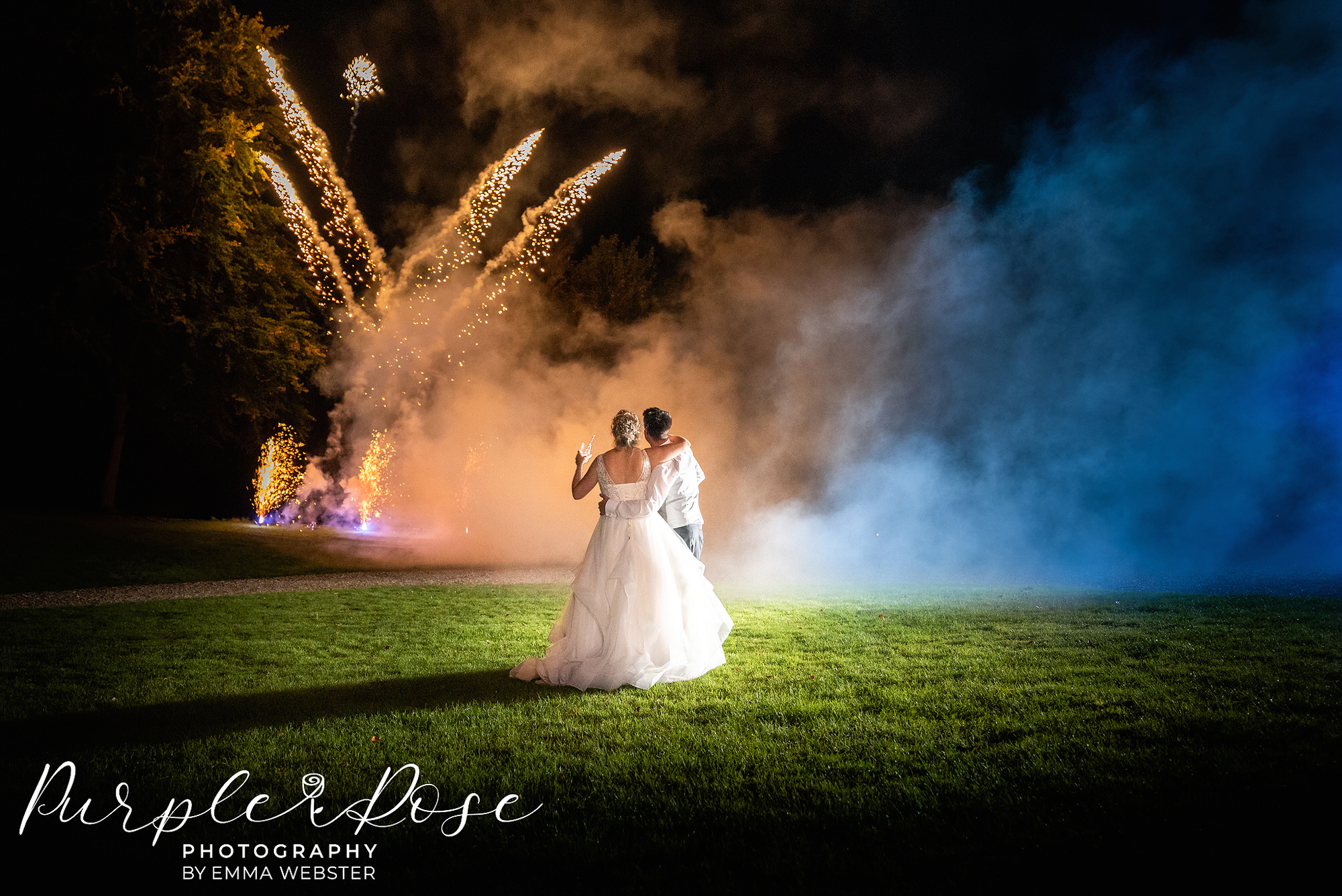 Photo of a bride and groom watching fire works on their wedding day in Milton Keynes