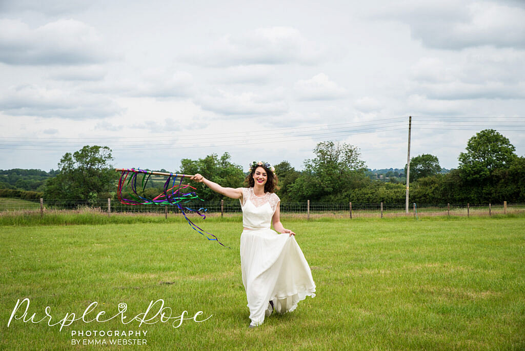 Bride running with ribbons