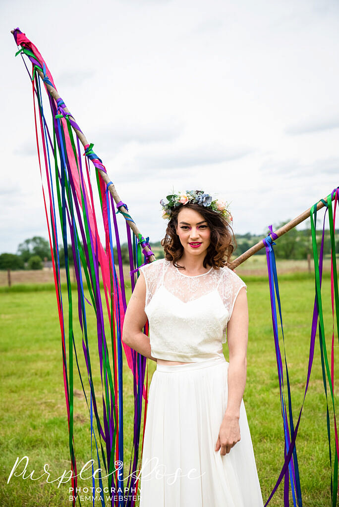 Bride standing in front of ribbons