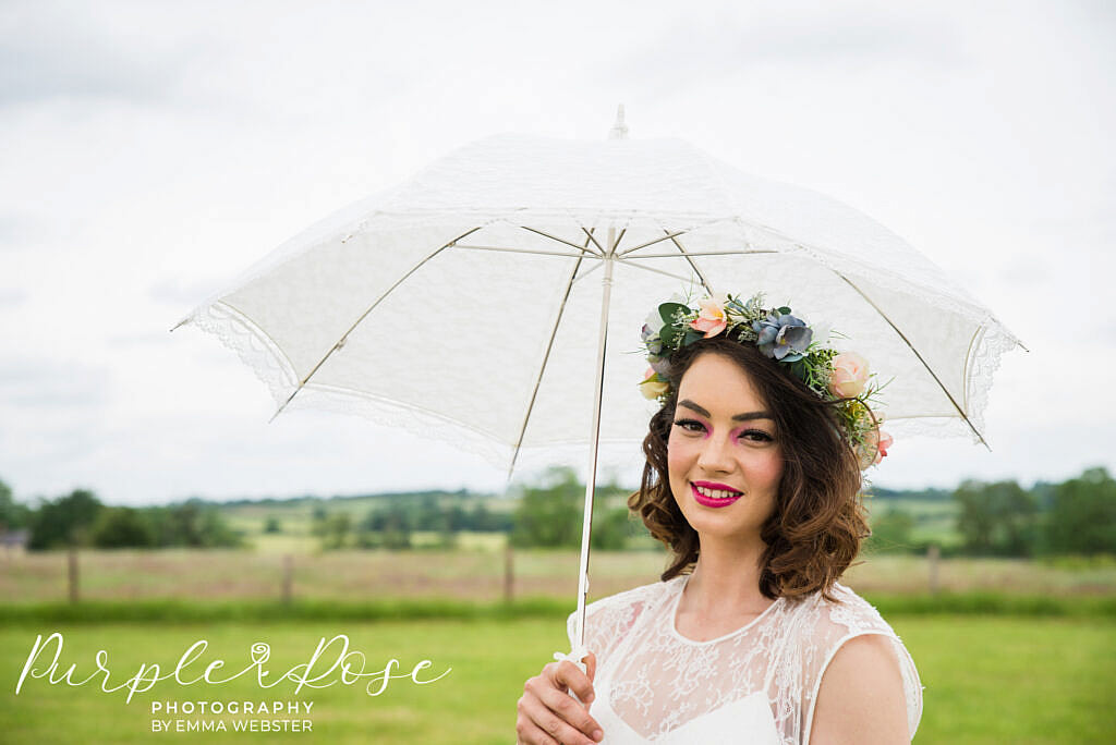 Bride with a white lace umbrella