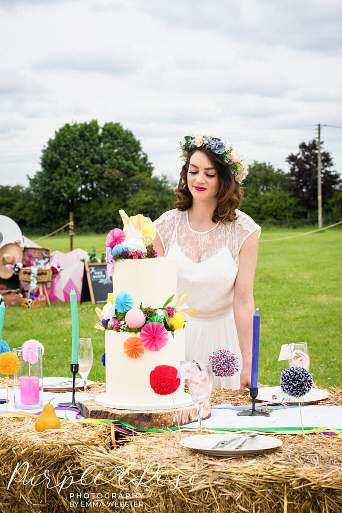 Bride looking at her wedding cake