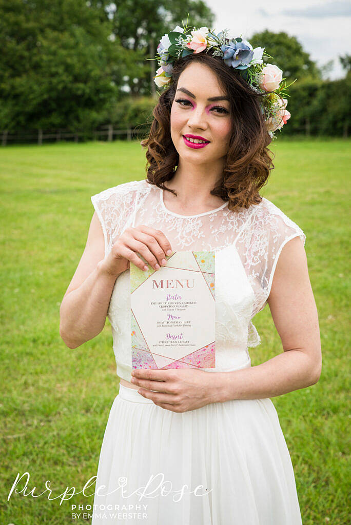 bride holding a menu