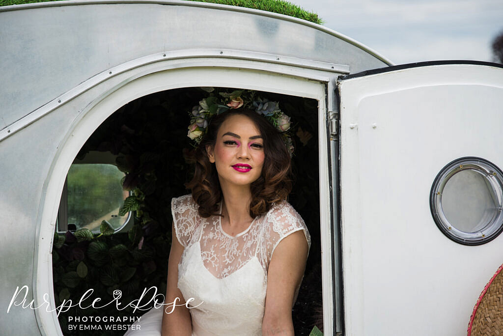 Bride looking out a door