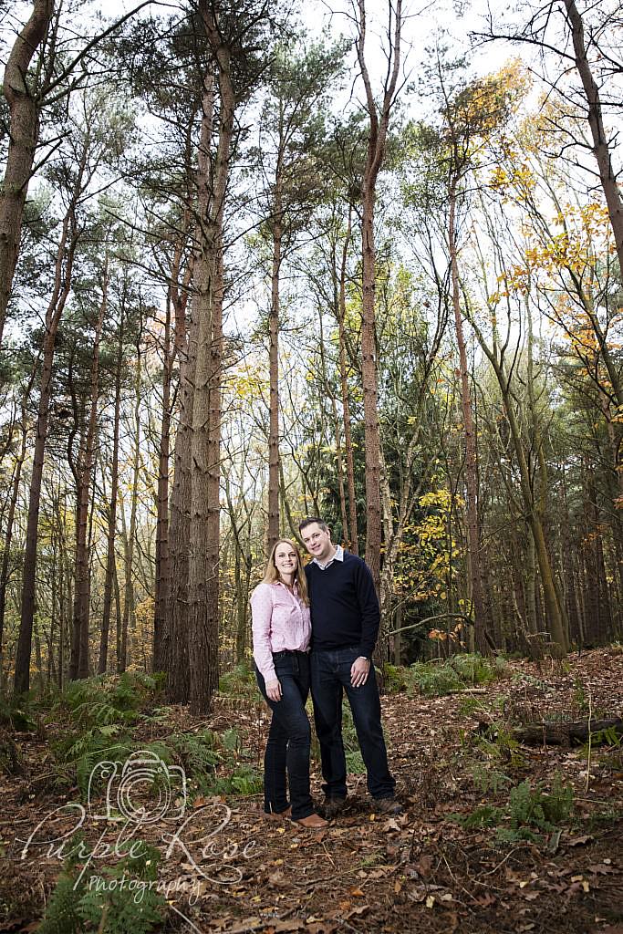 Couple standing in a forest