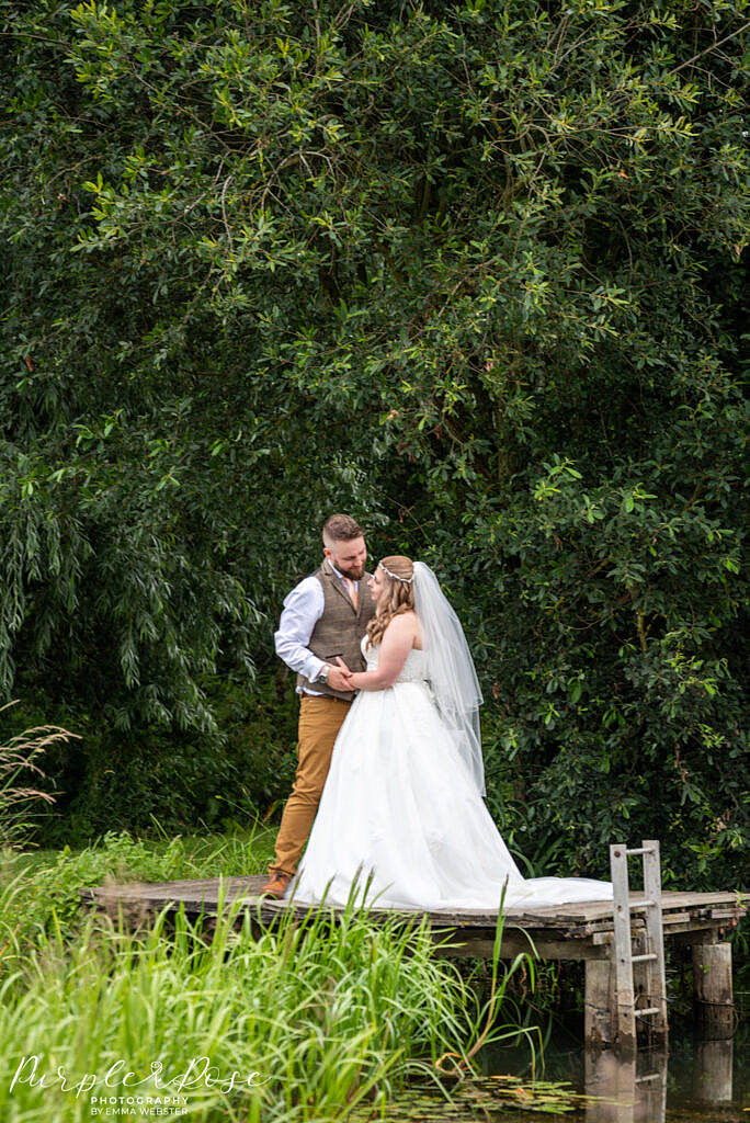 Bride and groom on a fishing platform