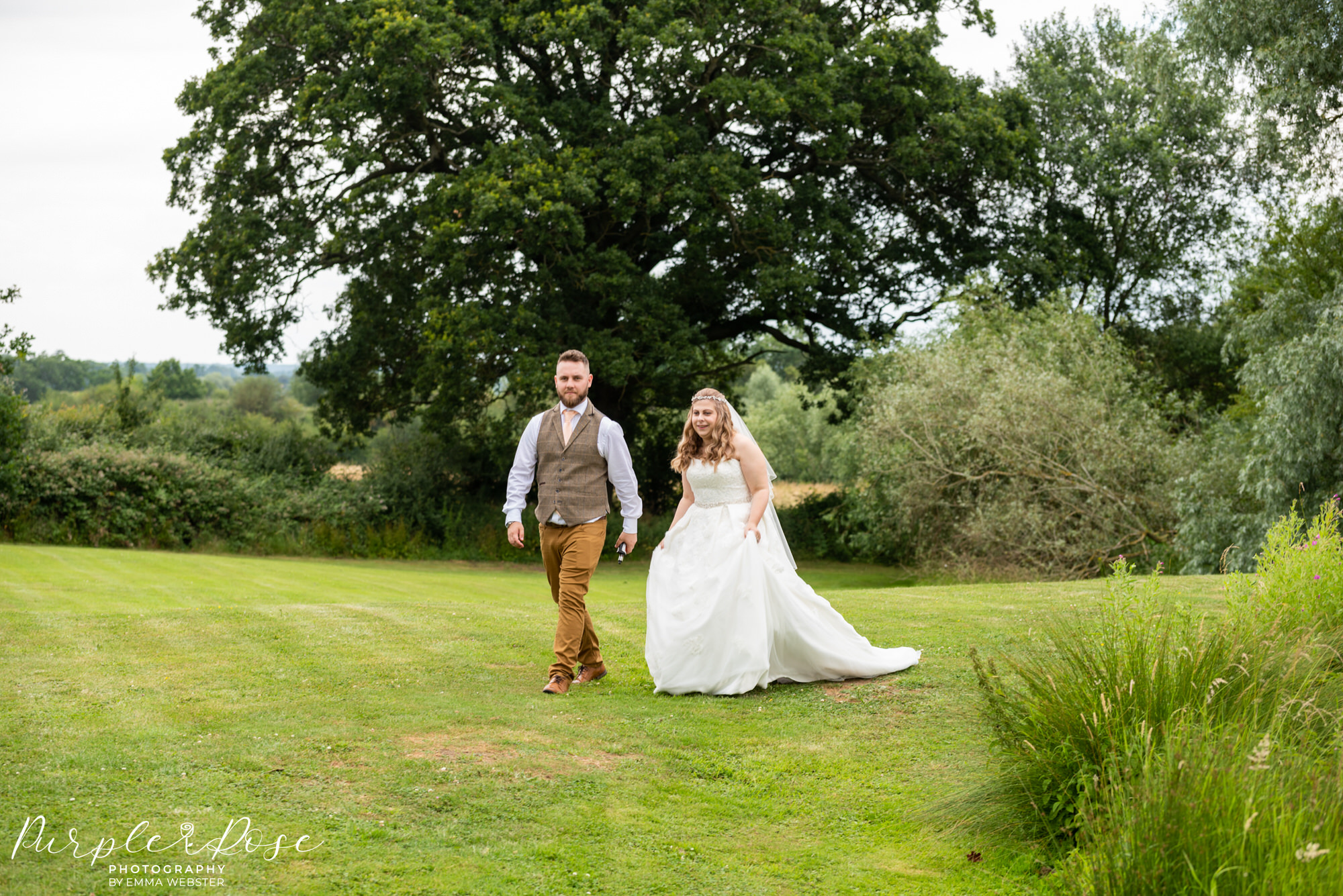 Bride and groom walking to their wedding venue