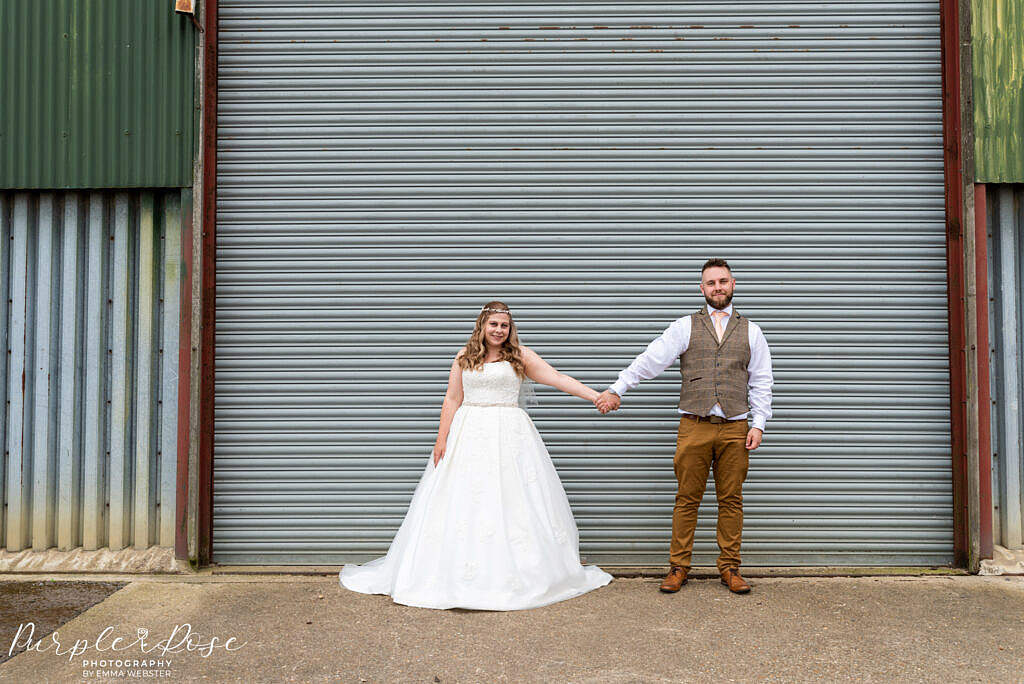 Couple in front of a barn door