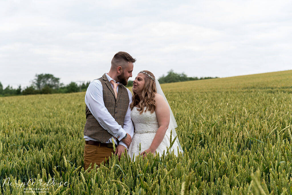 Bride and groom in a field