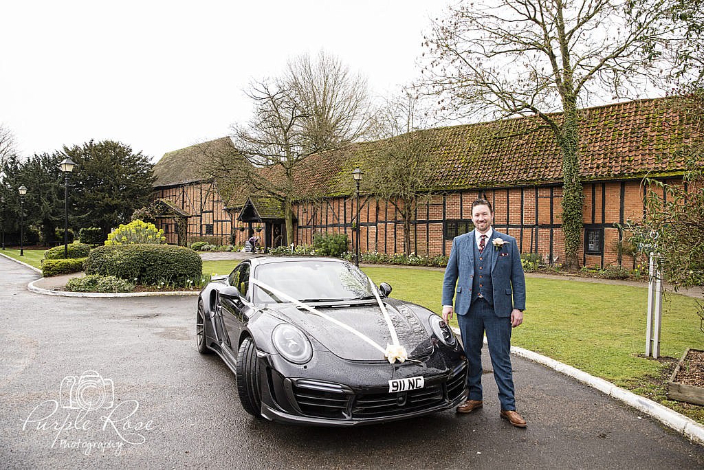 Groom standing outside the Barns Hotel Bedford