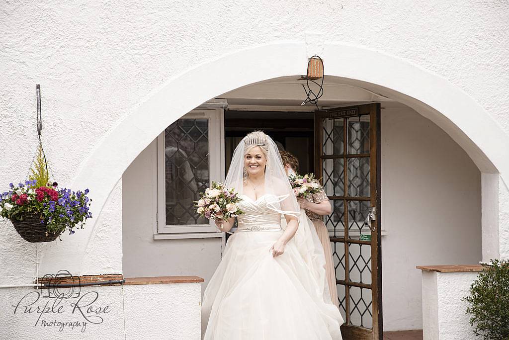 Bride and bridal party walking to the wedding ceremony