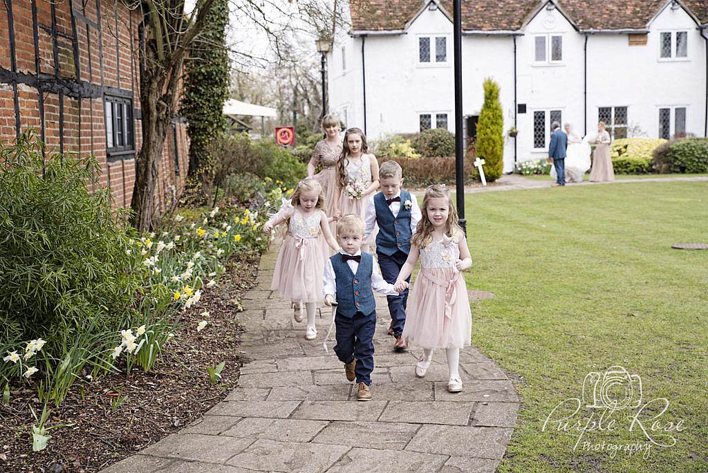 Bride and bridal party walking to the wedding ceremony