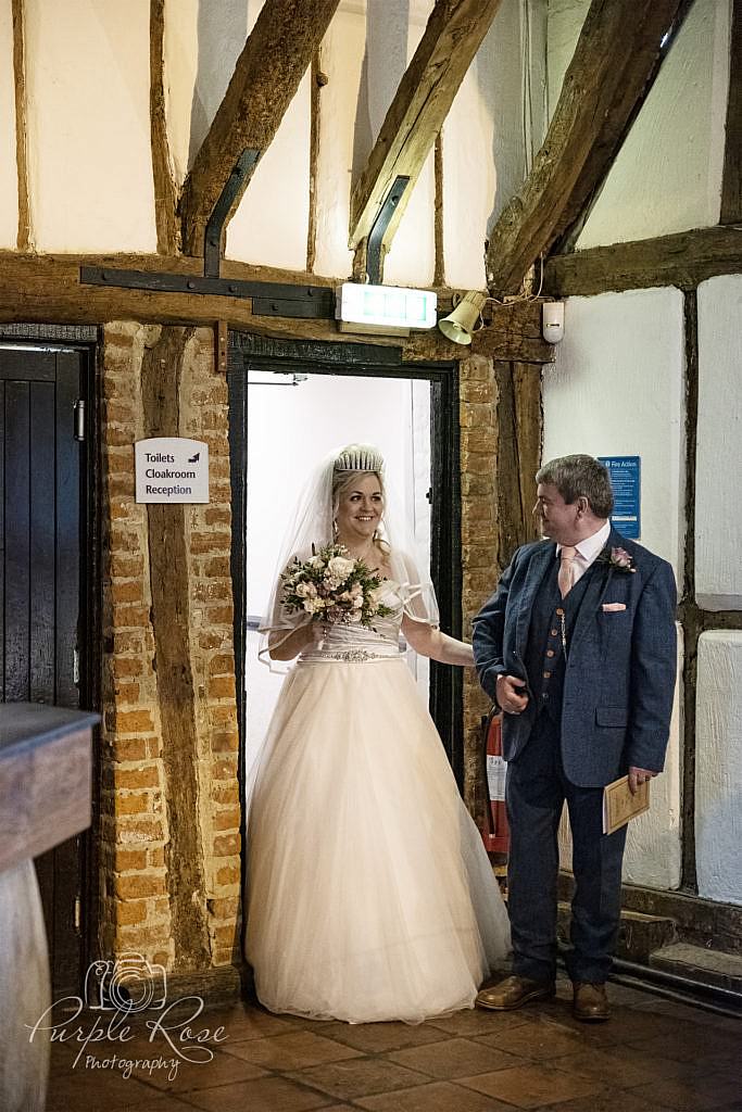 Father walking his daughter to her wedding ceremony