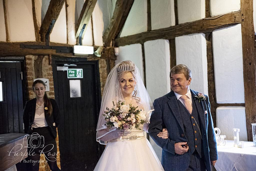 Father walking his daughter to her wedding ceremony